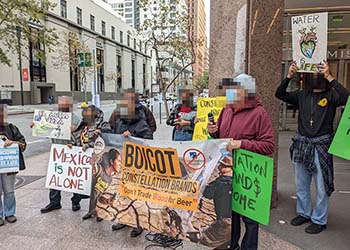 Mexicali Resiste protestors, joined by Alcohol Justice, rally in front of the Constellation Brands headquarters at 101 Mission St. in San Francisco