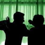 a dramatically backlit image of domestic violence