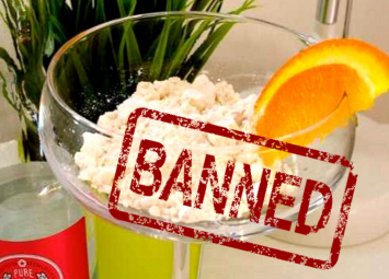 A glass of powdered alcohol with a banned stamp on it