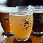 a glass showing the logo of Oregon-made Deschutes Beer